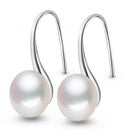 Exagerrated Curved Pearl Earrings